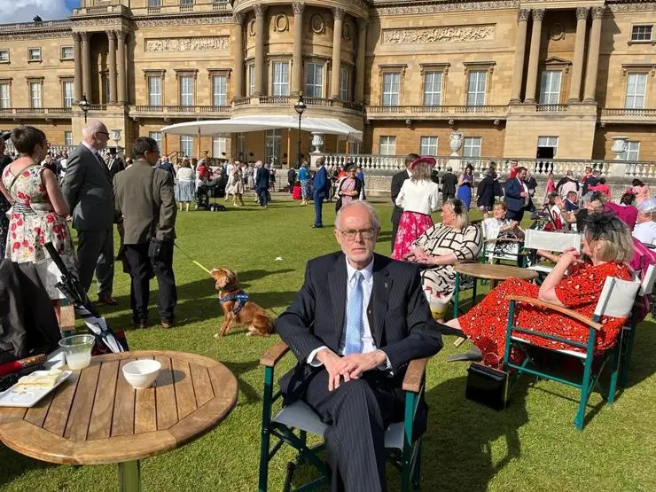 Russell sits in the Palace Gardens